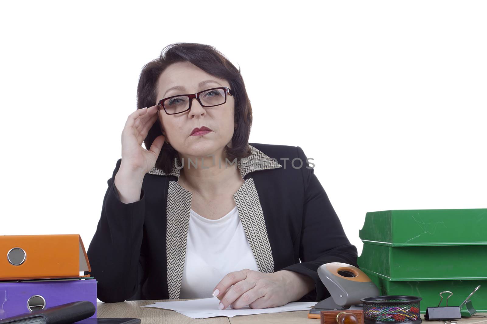 Business woman at the desk on a white background