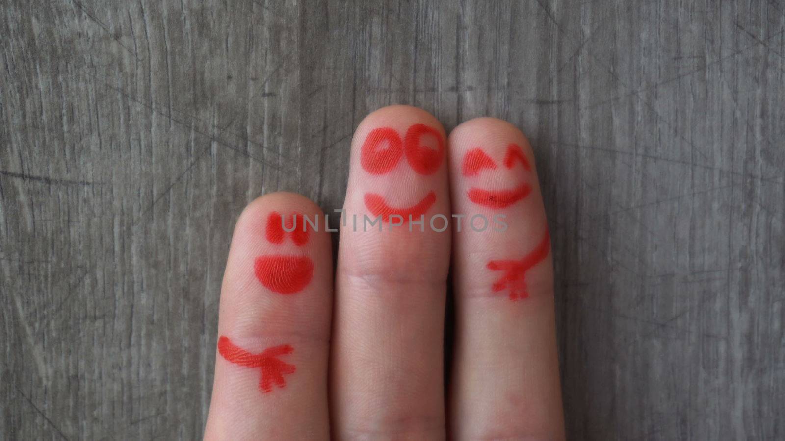 happy fingers.beautiful faces painted on the toes.