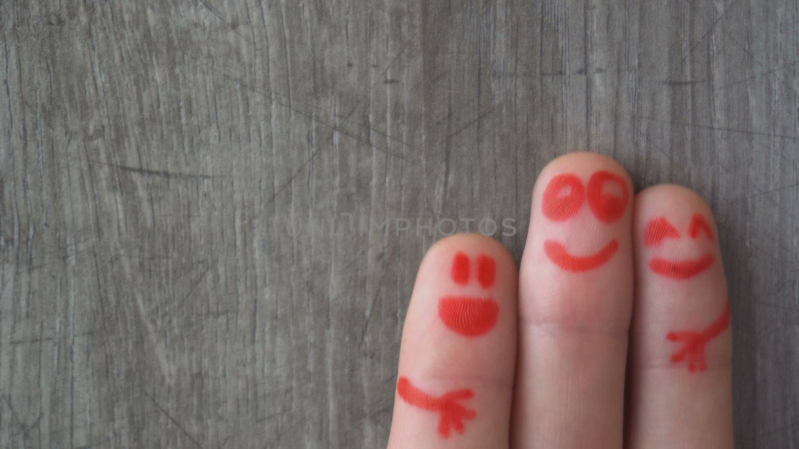 happy fingers.beautiful faces painted on the toes.