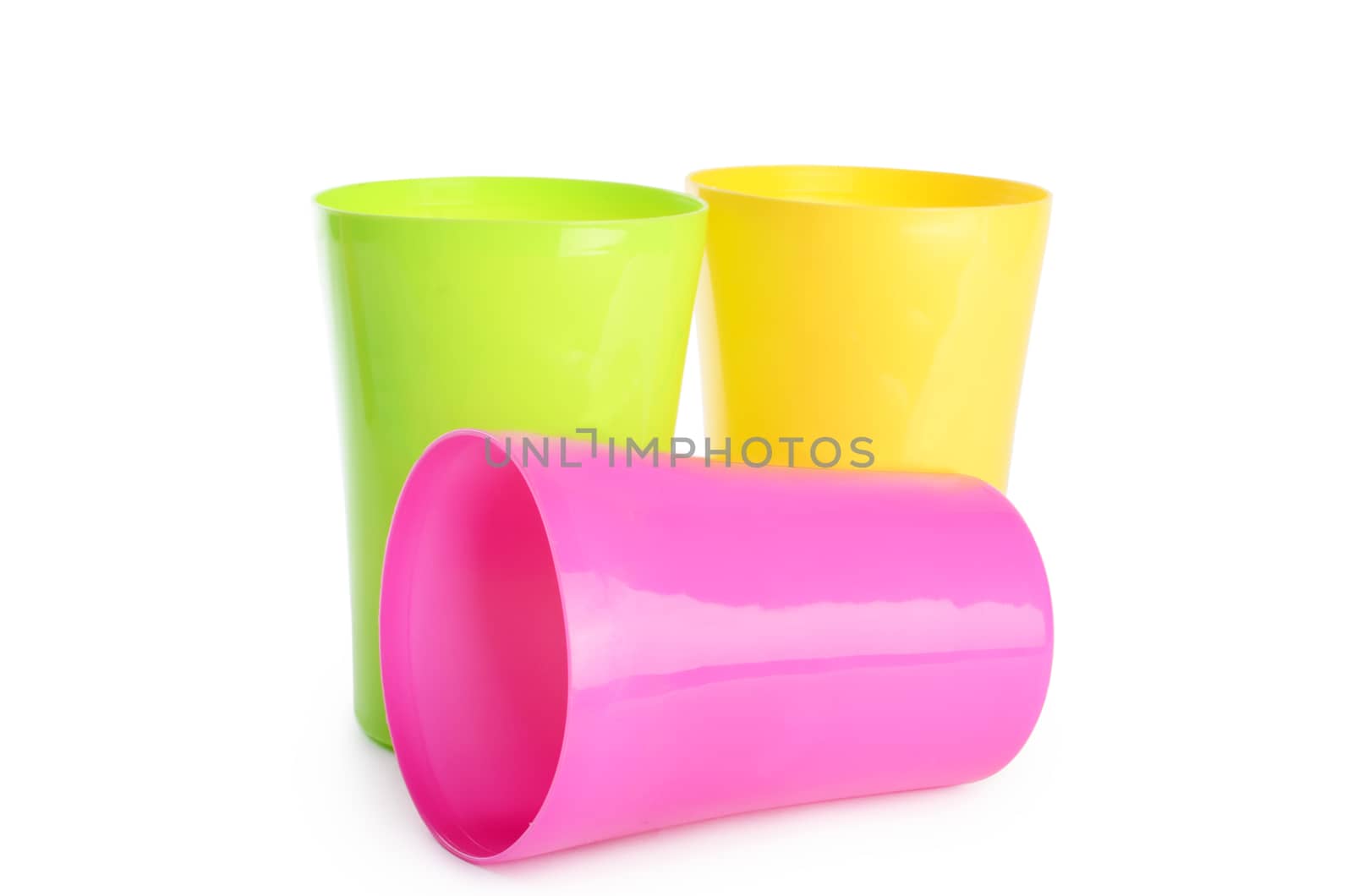 Plastic colorful cups isolated on white background
