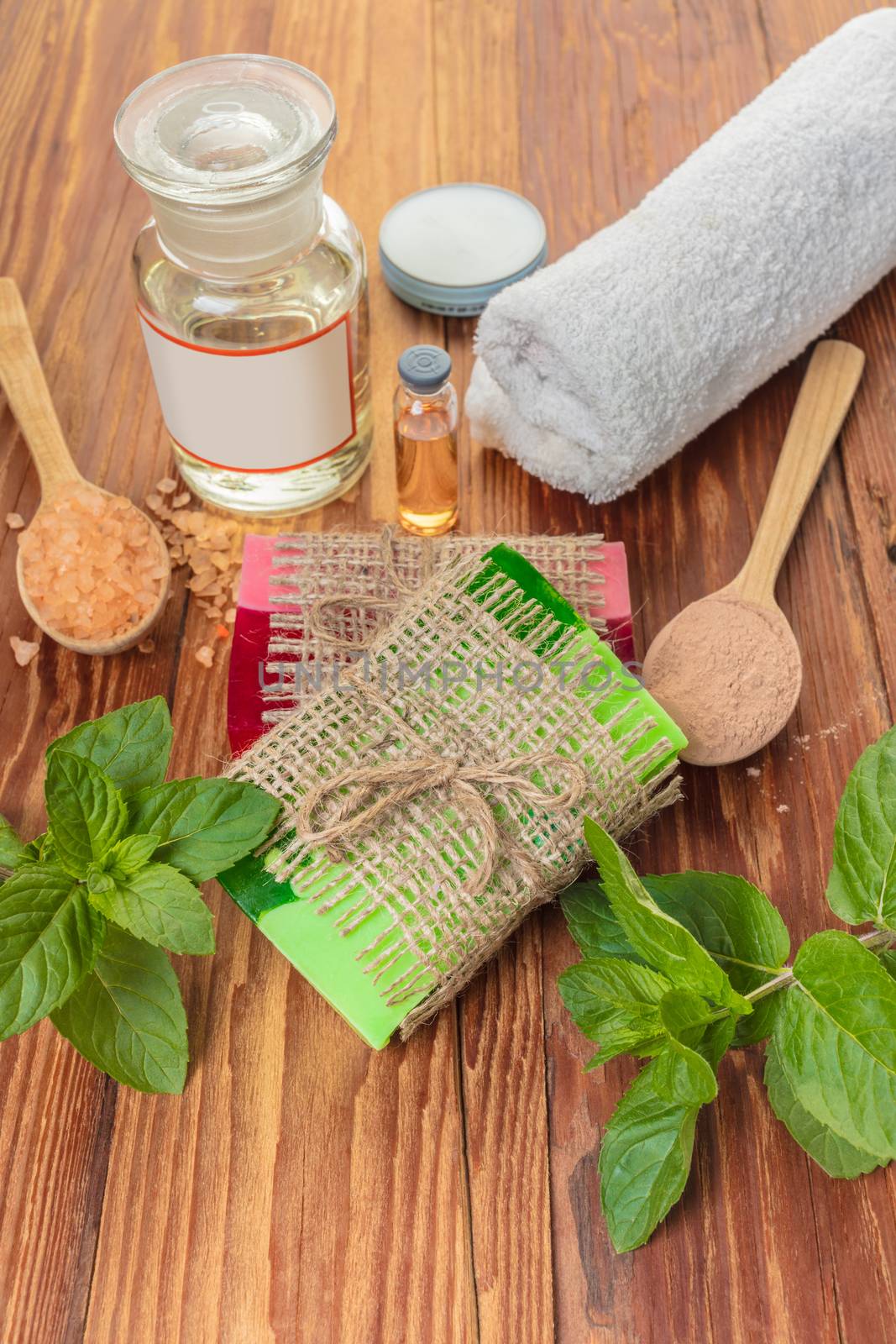 Handmade soap with oils on a wooden background