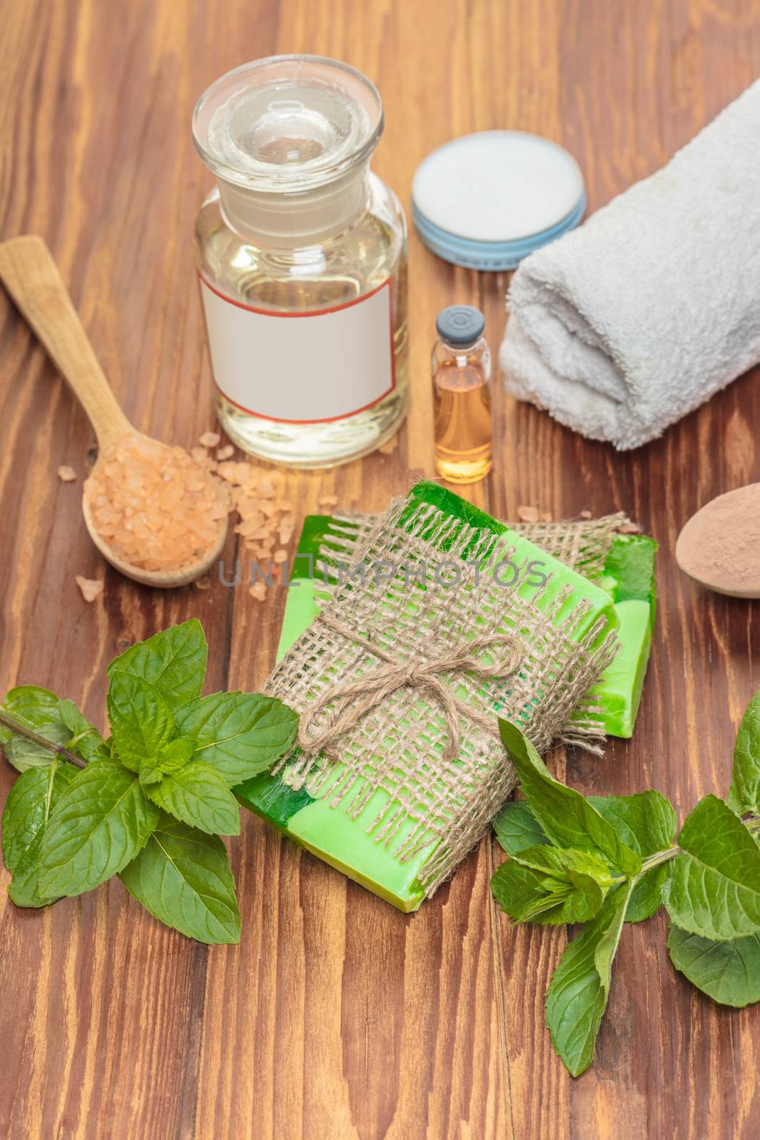 Green mint handmade soap on a wooden background