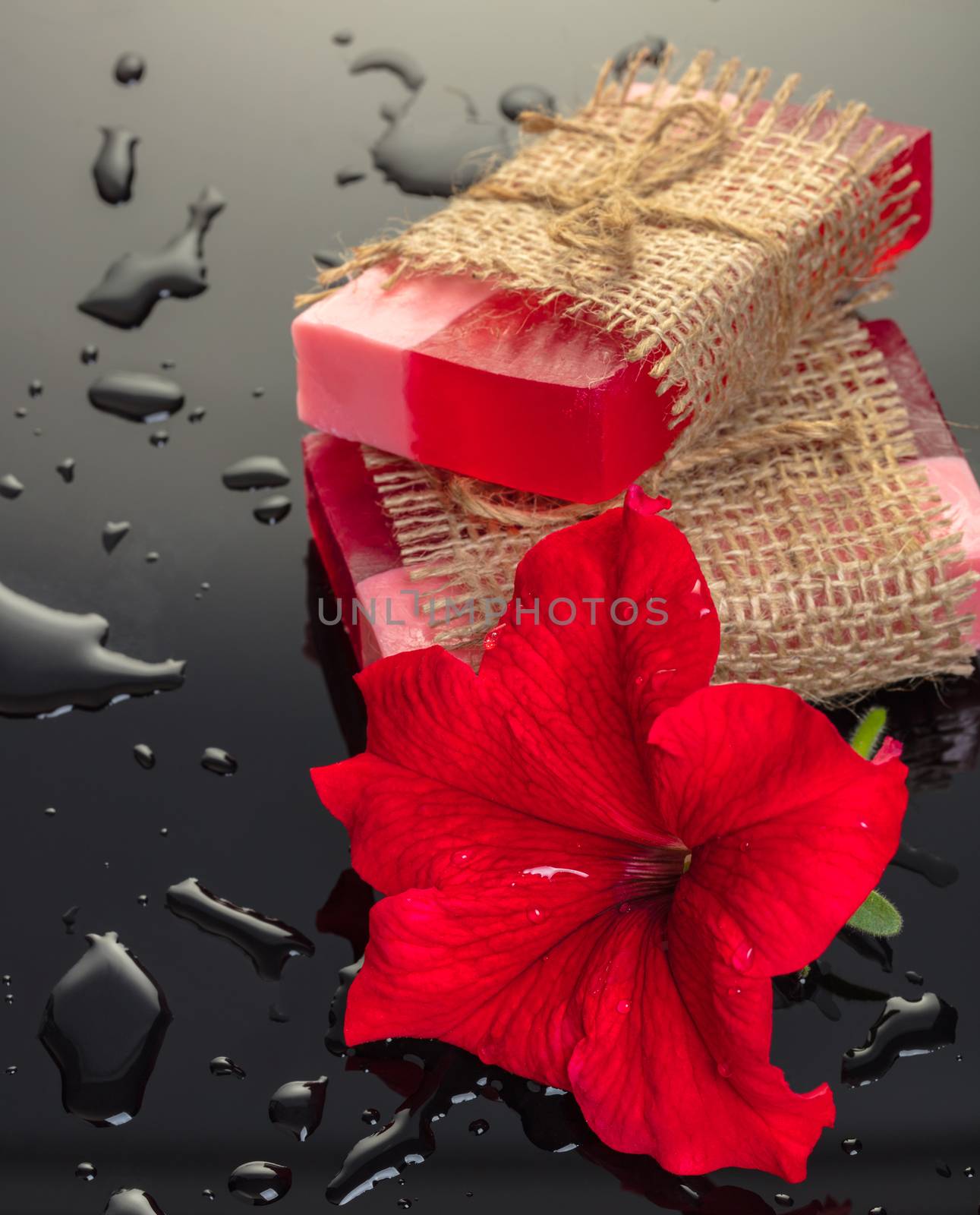 Handmade soap red with a flower on black background