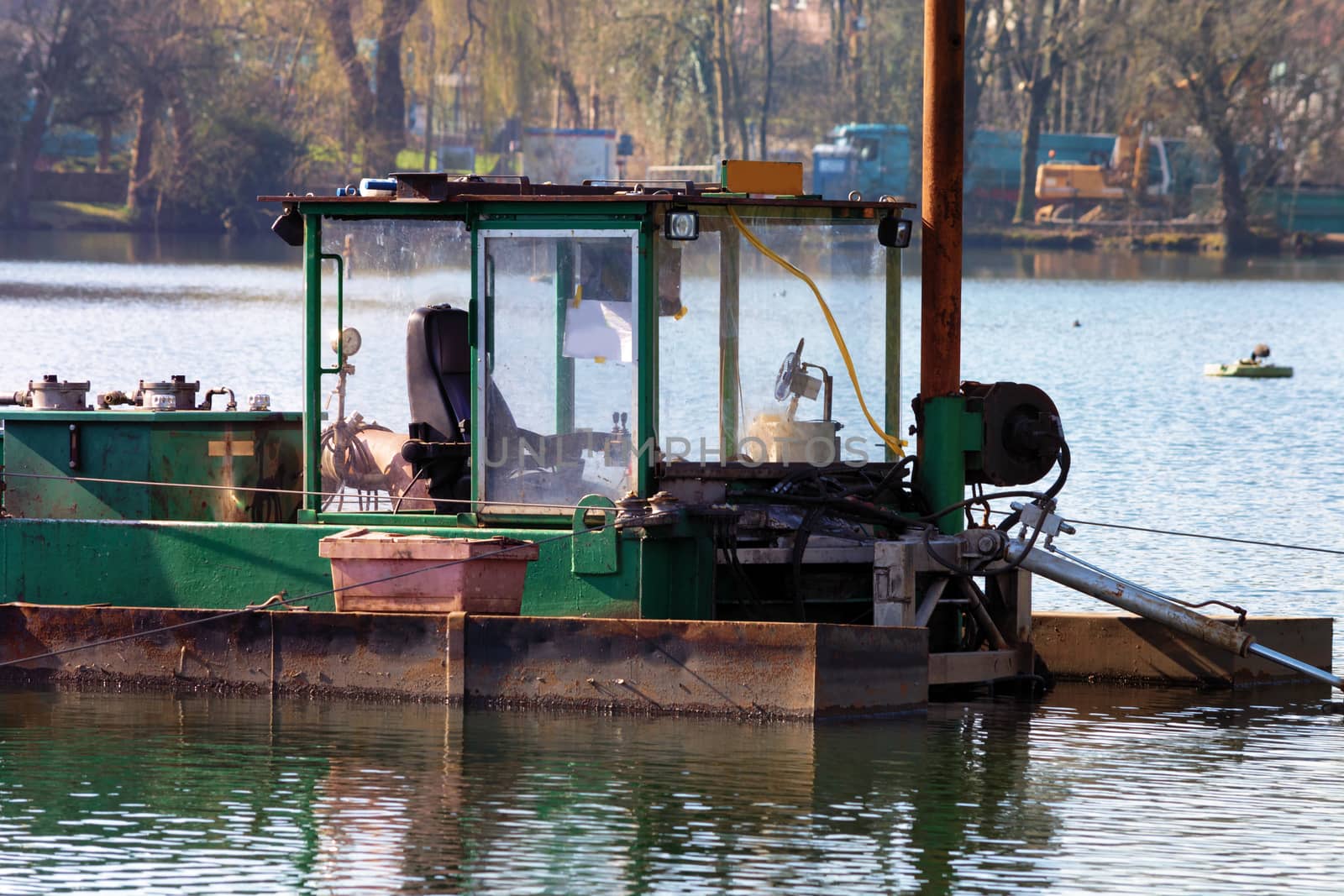 Dredger, Floating excavator when dredging of soil, sand and silt from a river.