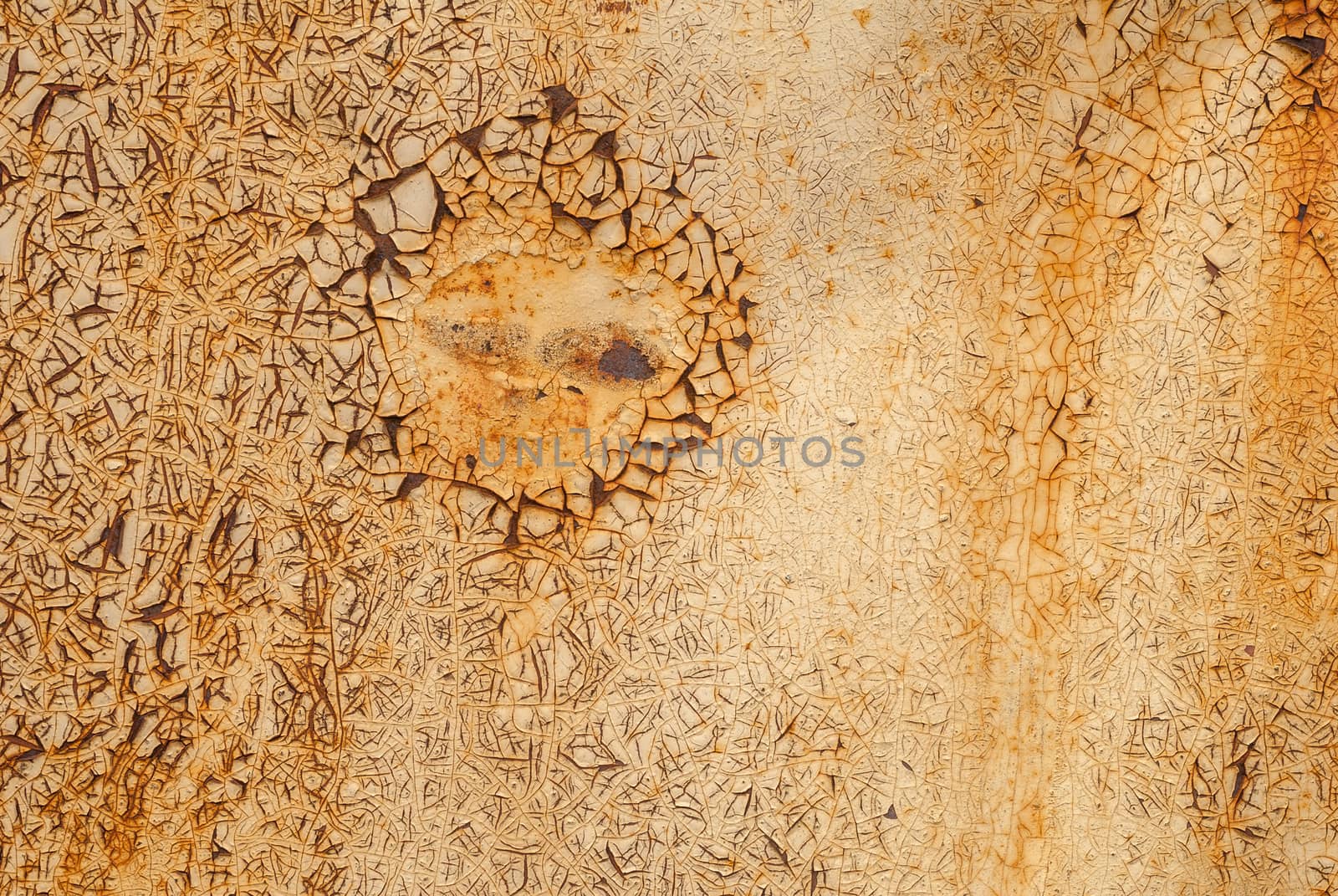 rusty iron surface covered with old chipped yellow color paint, which has long been influenced by different climatic conditions