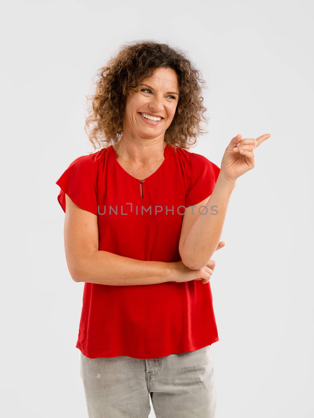 Happy woman pointing by Iko