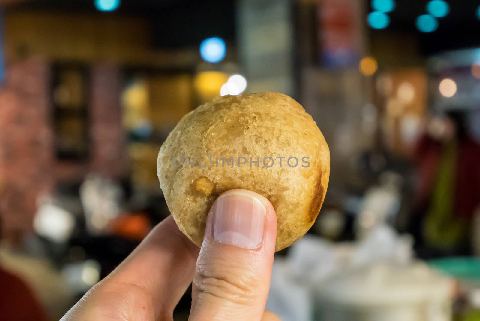 The close up of Taiwan deep fried taro ball at food street night market in Taipei.