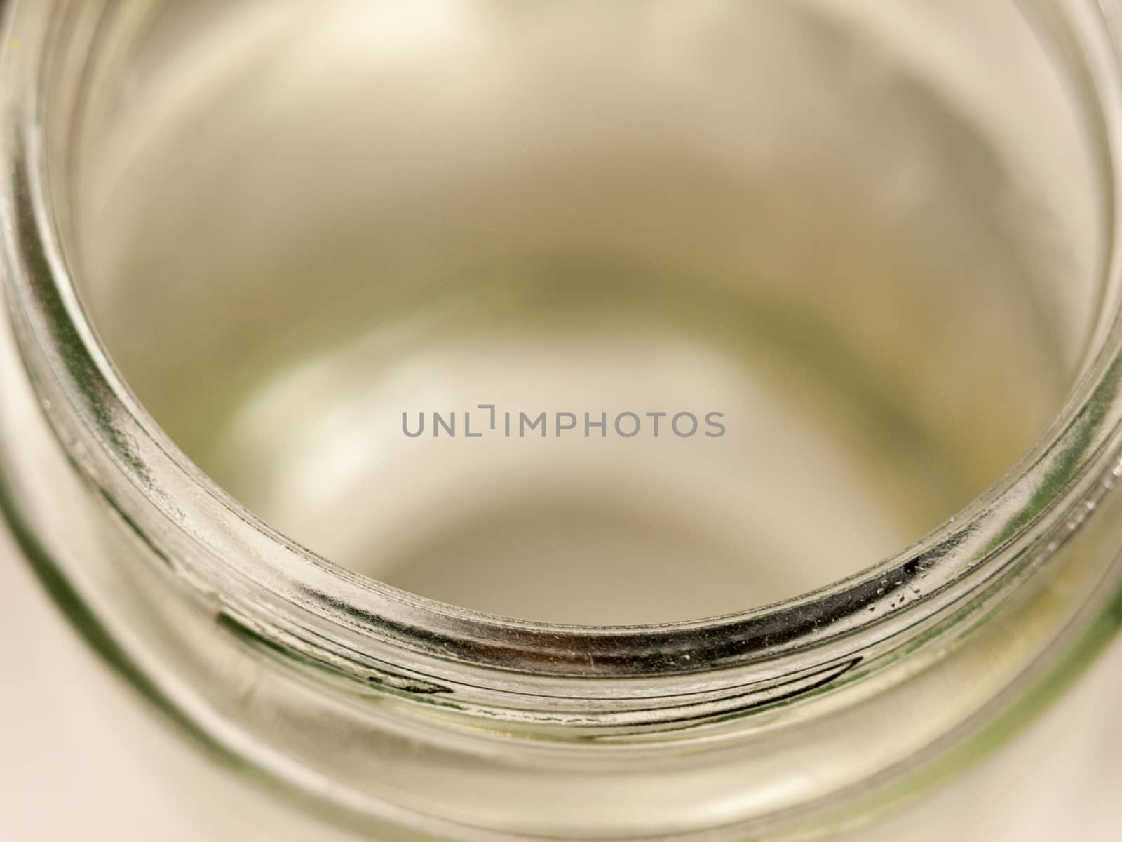 the rim of a glass jar up close clear and shining no lid