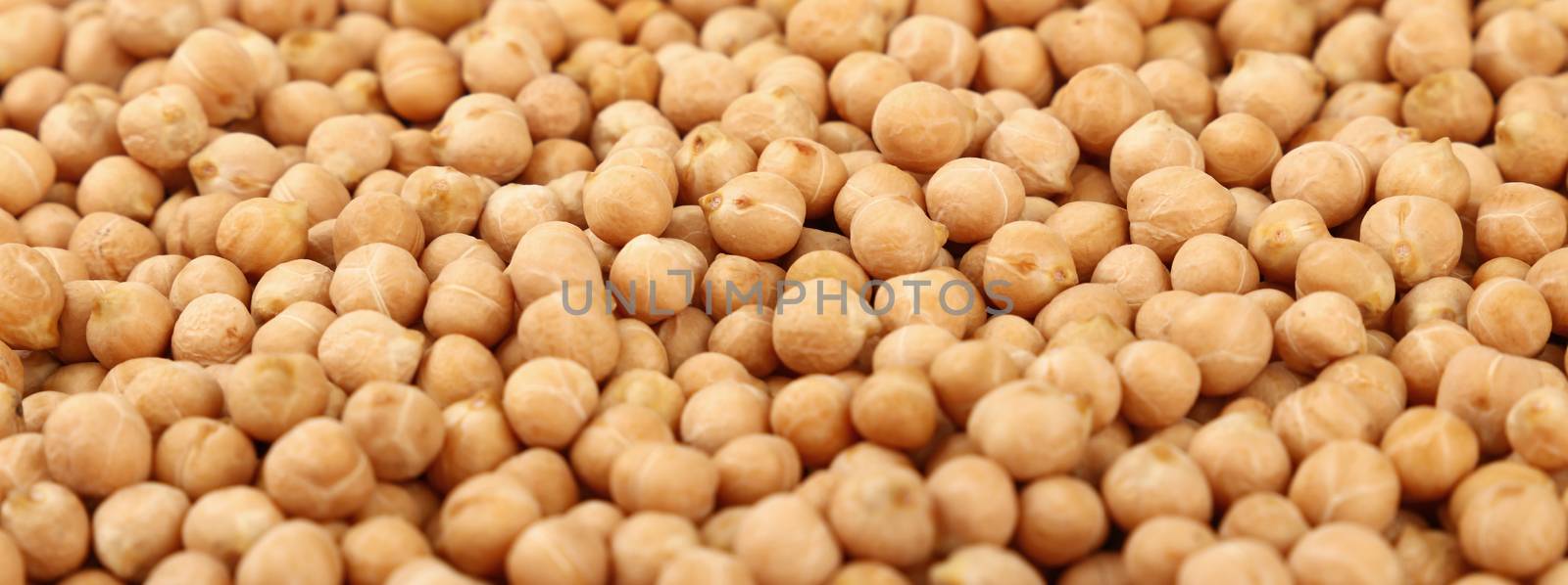Dried chickpea beans at retail market display, close up pattern background, low angle view