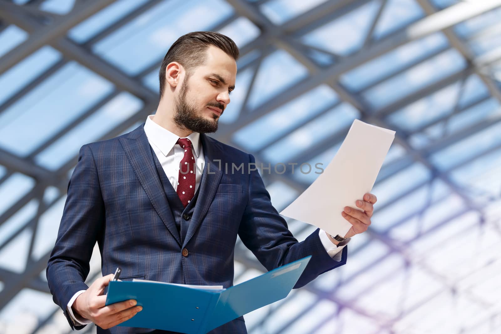 Businessman holding binder by ALotOfPeople