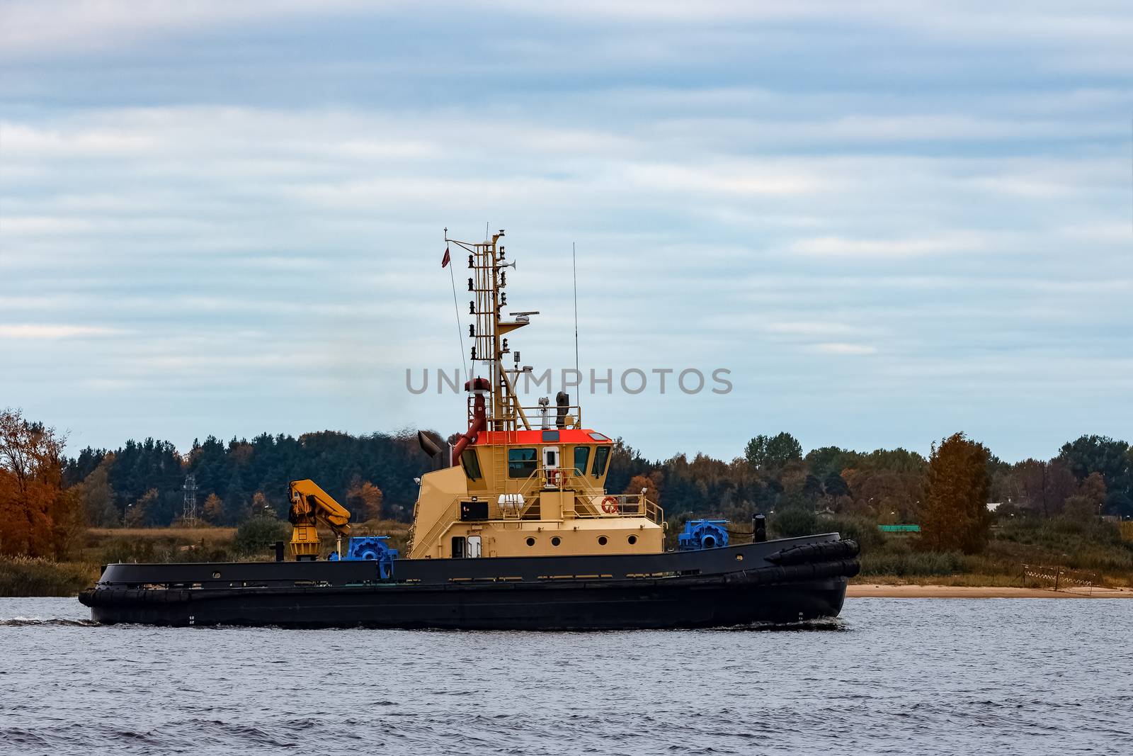 Tug ship in the cargo port of Riga, Europe