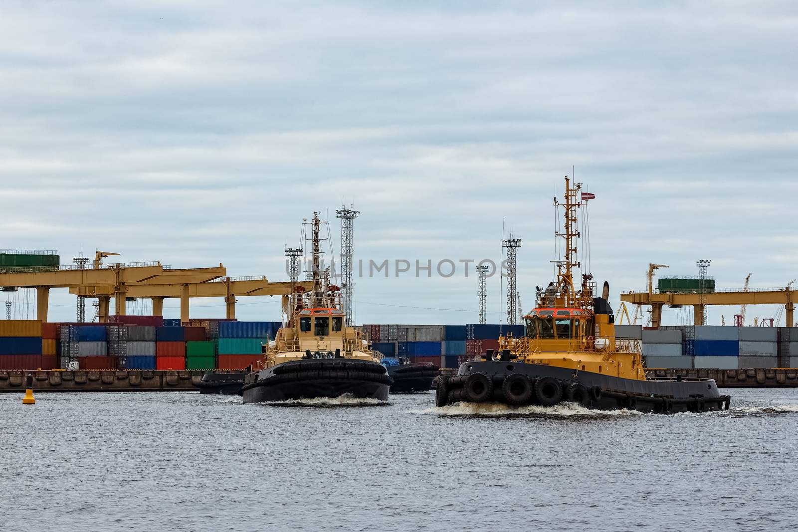 Tug ships in the cargo port of Riga, Europe