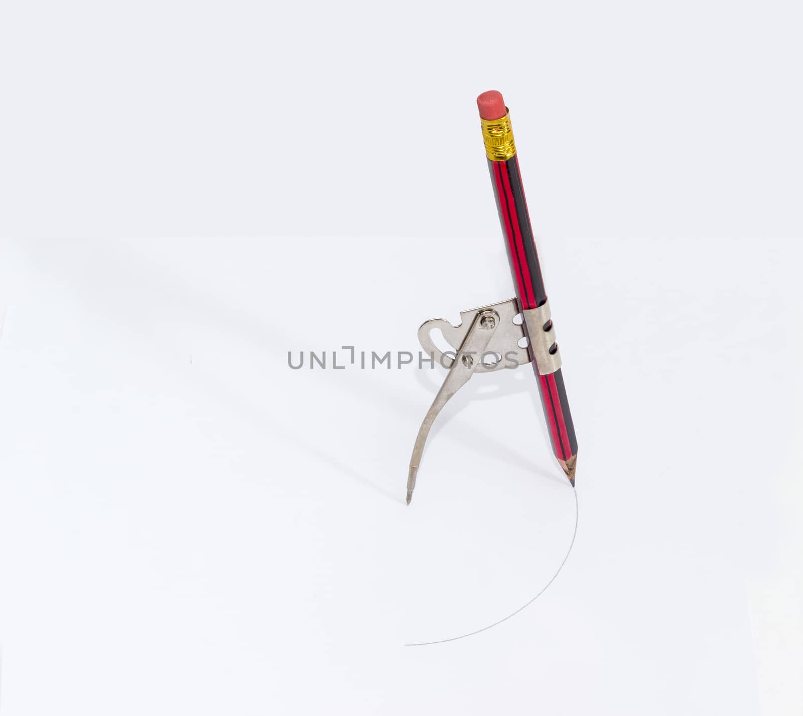 Simple school metal compass with an inserted pencil by anmbph