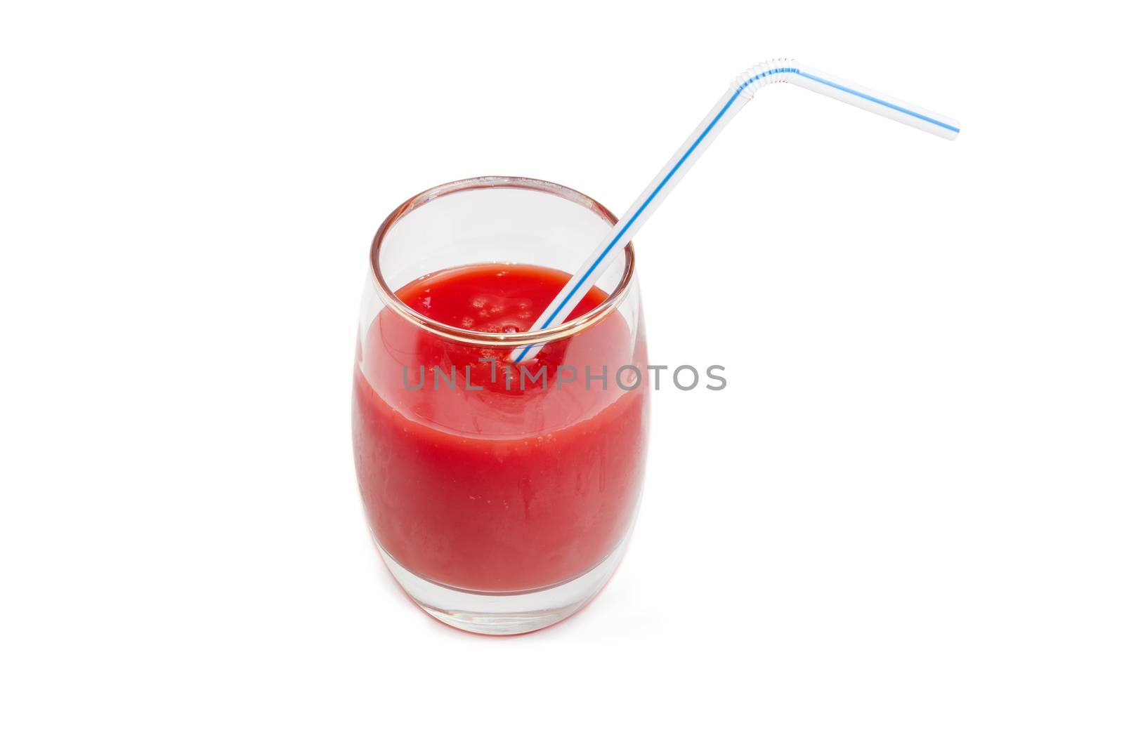 Tomato juice in glass with bendable drinking straw on a light background
