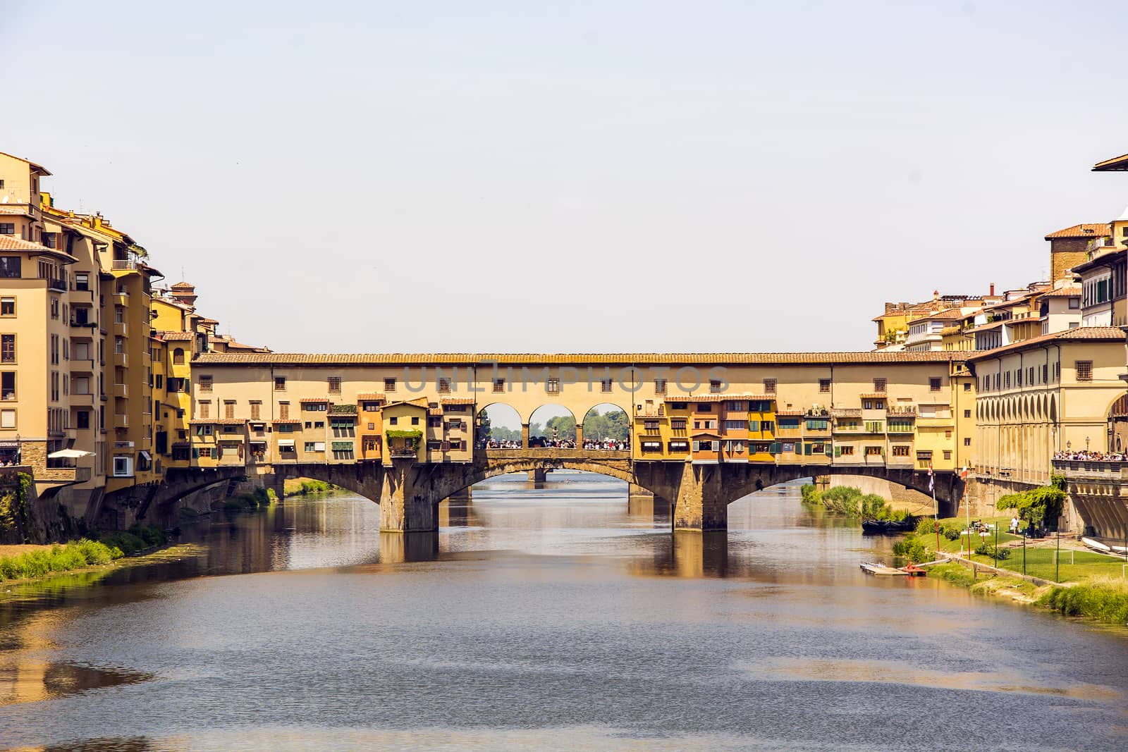 Medieval stone bridge Ponte Vecchio over the Arno River in Florence, Tuscany, Italy. Florence is a popular tourist destination of Europe