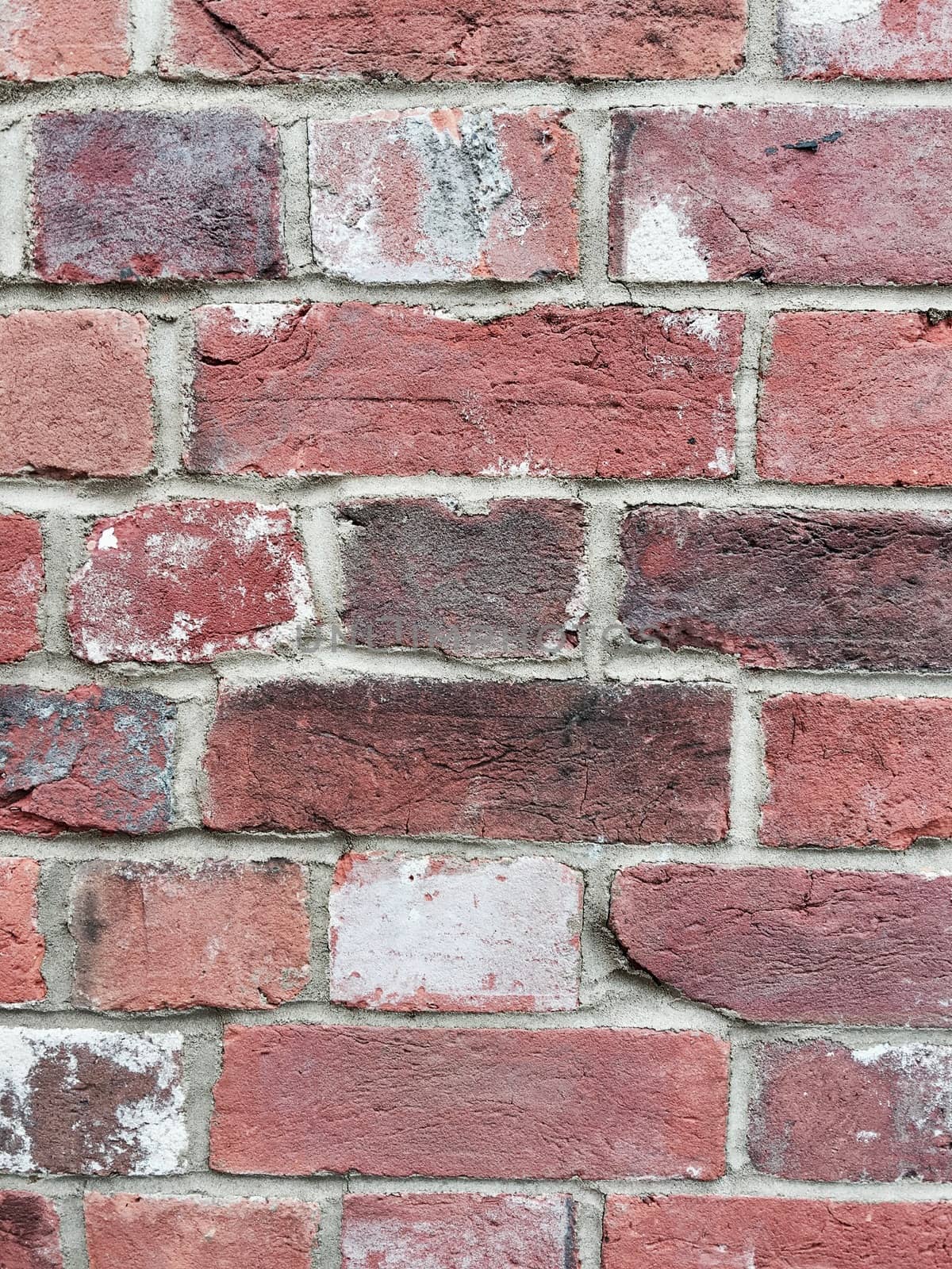 Old and dirty brick wall with broken structure in Bedfordshire.
