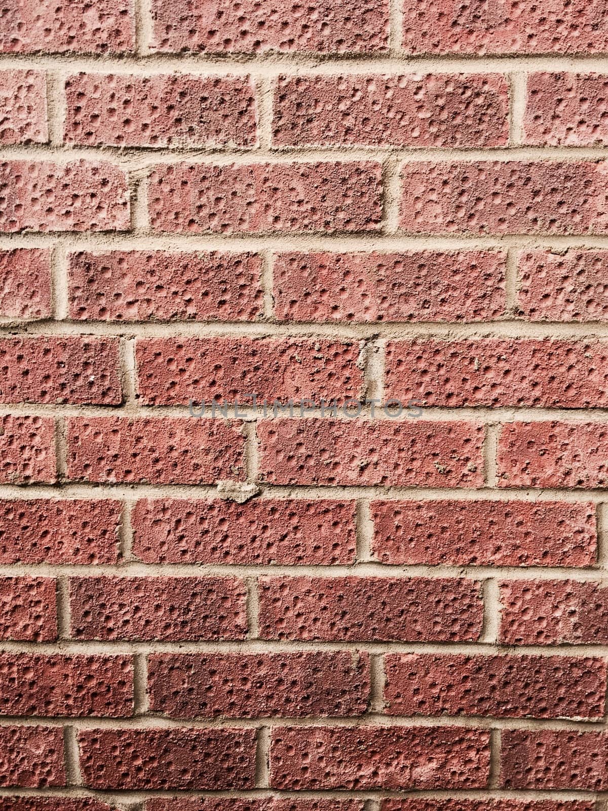 Brown vintage brick wall with clean structure. Old house facade.