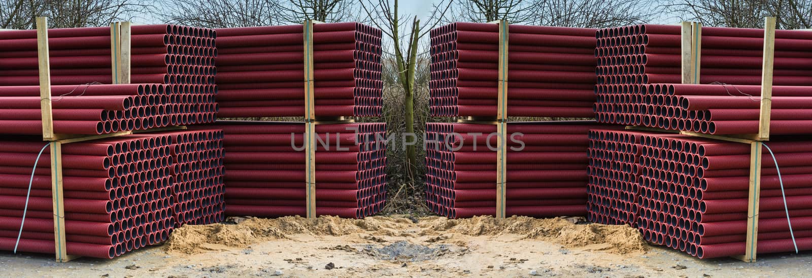 Stockyard of various tubes and pipes at a construction site.