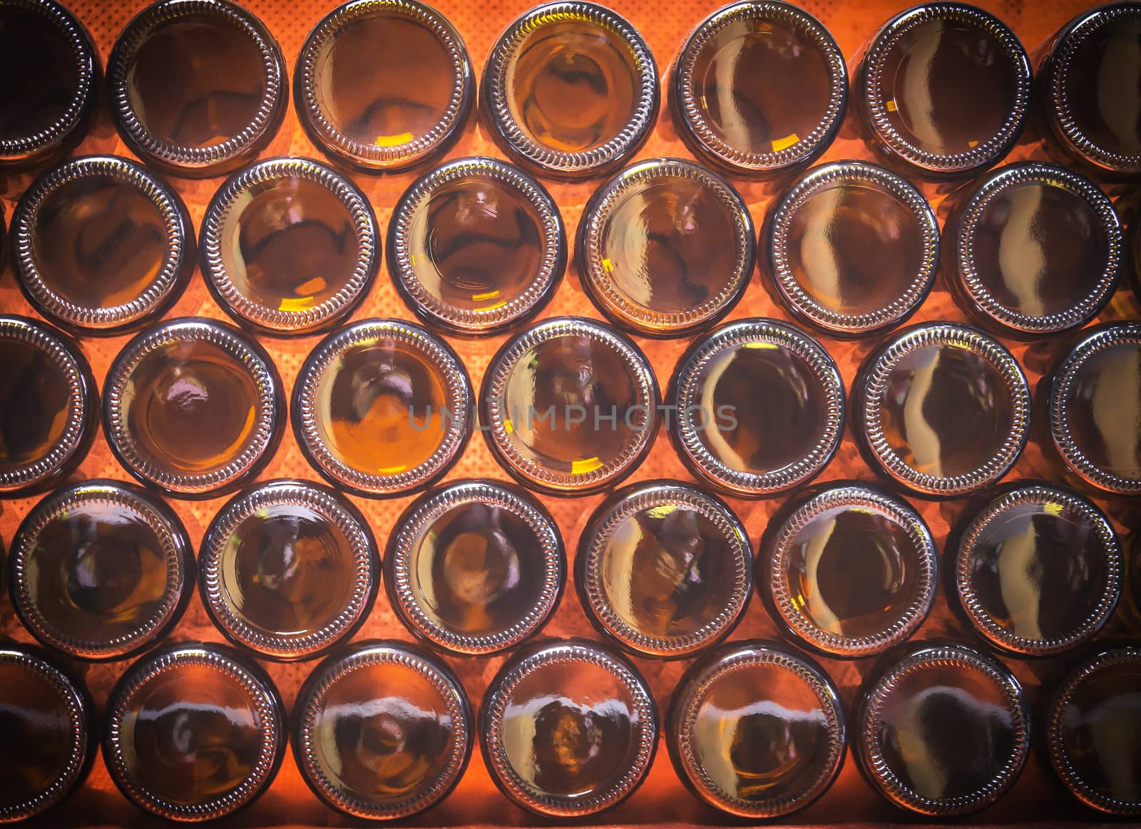 Closeup bottoms of brown color bottles background