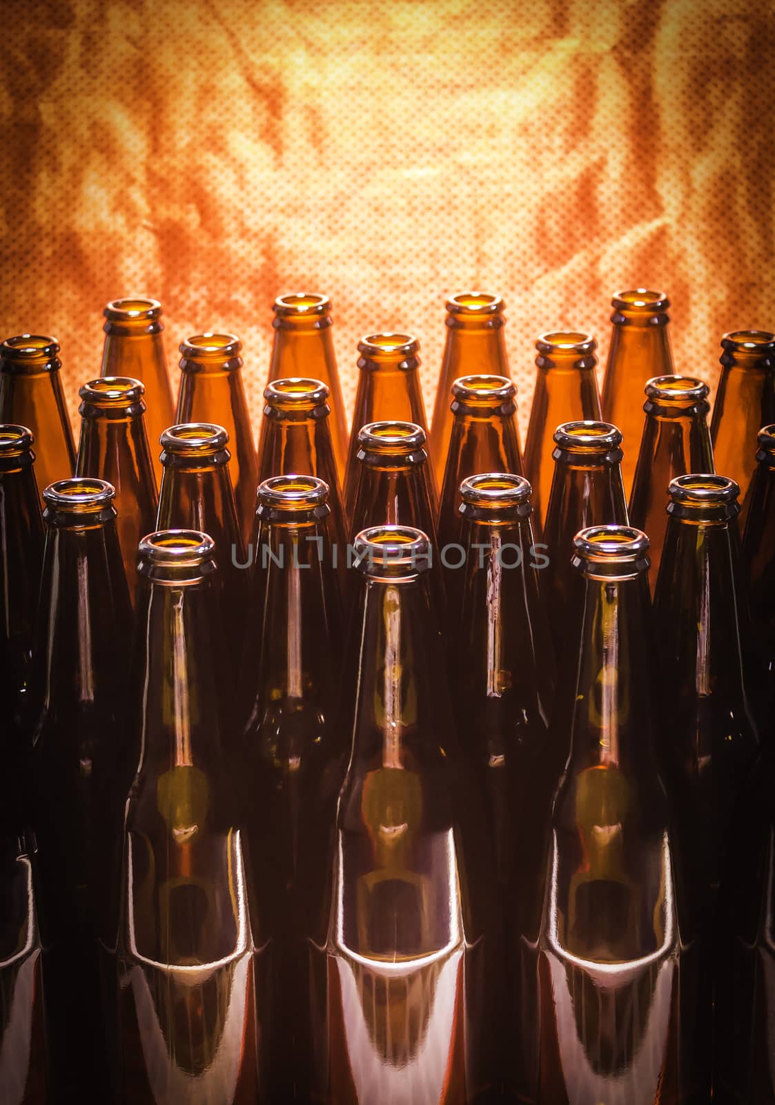 Rows of brown color empty bottles beer
