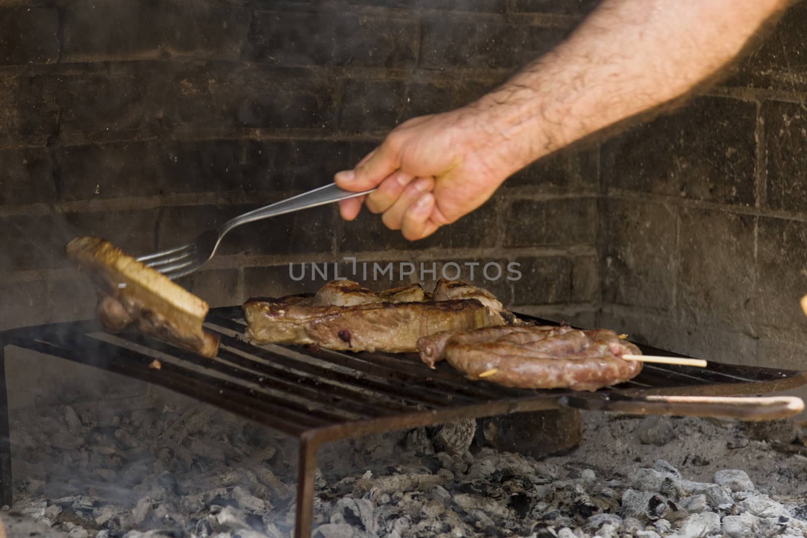 Meat roast in the barbecue in the countryside