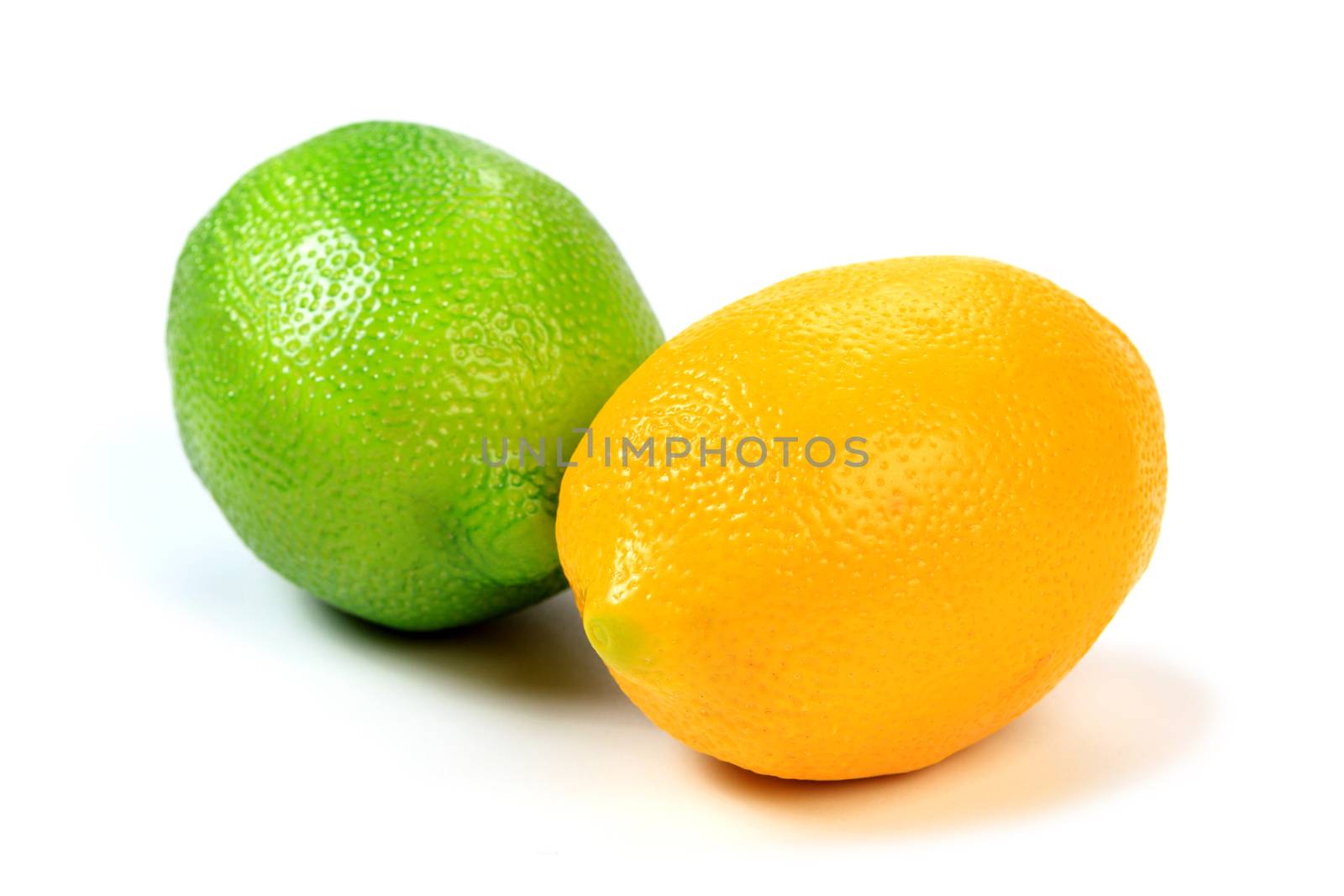 Closeup shot of green and yellow lemons isolated on white backgr by Nobilior