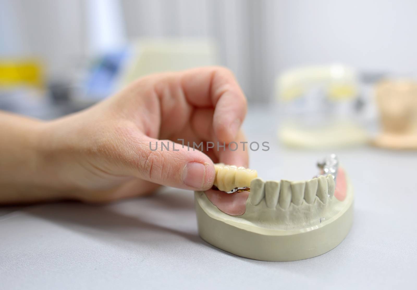 Closeup of dental technician working