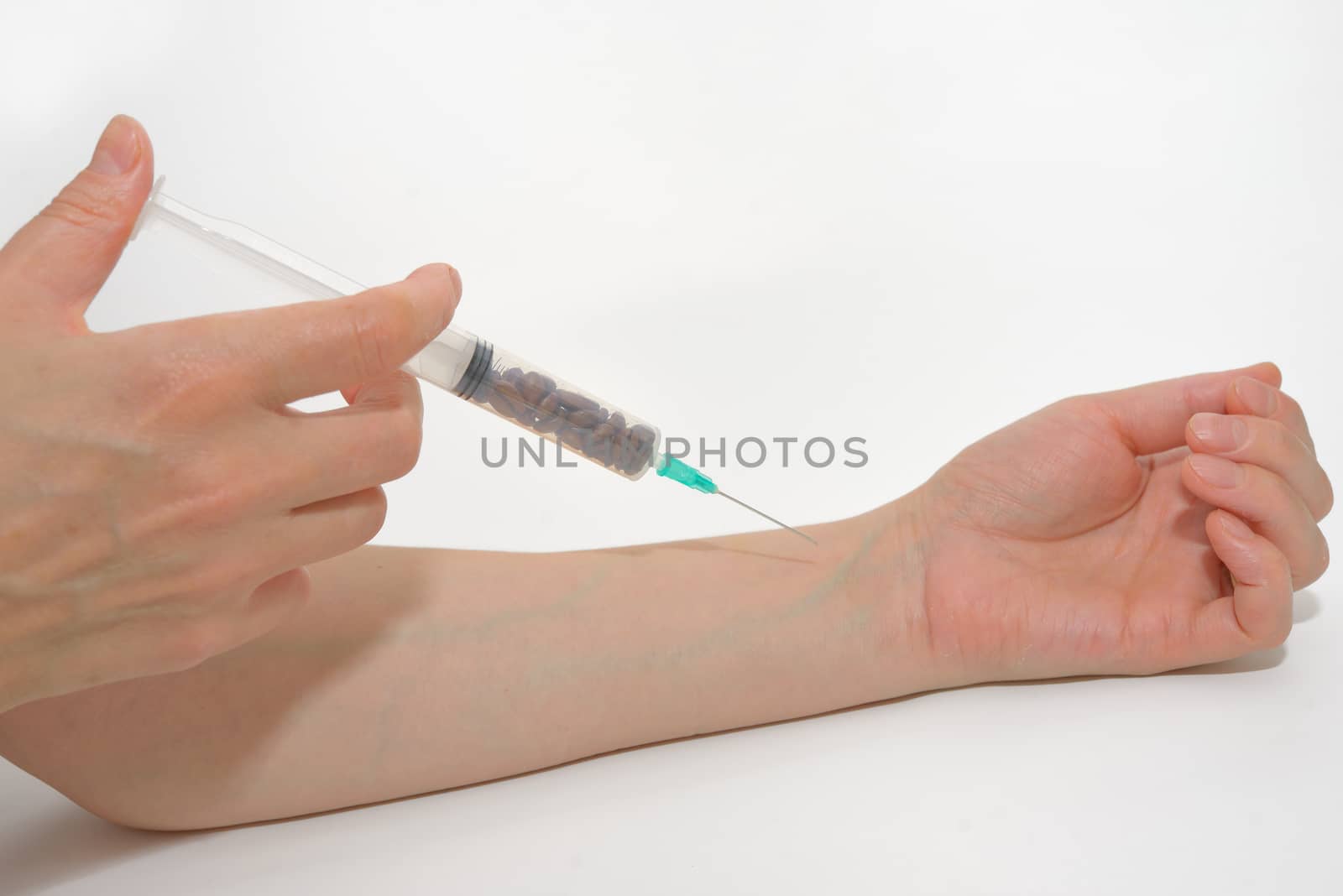 Coffee beans in syringe acting injection