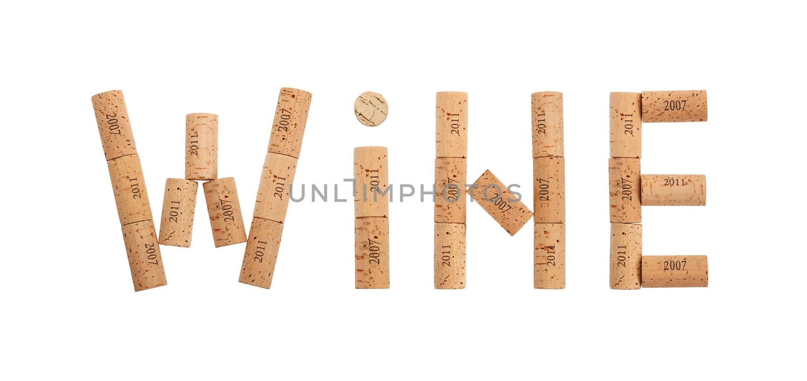 Word WINE shaped by natural wooden wine bottle corks of different vintage years isolated on white background