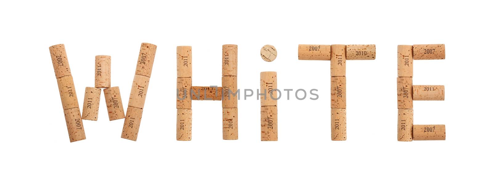 Word WHITE shaped by natural wooden wine bottle corks of different vintage years isolated on white background