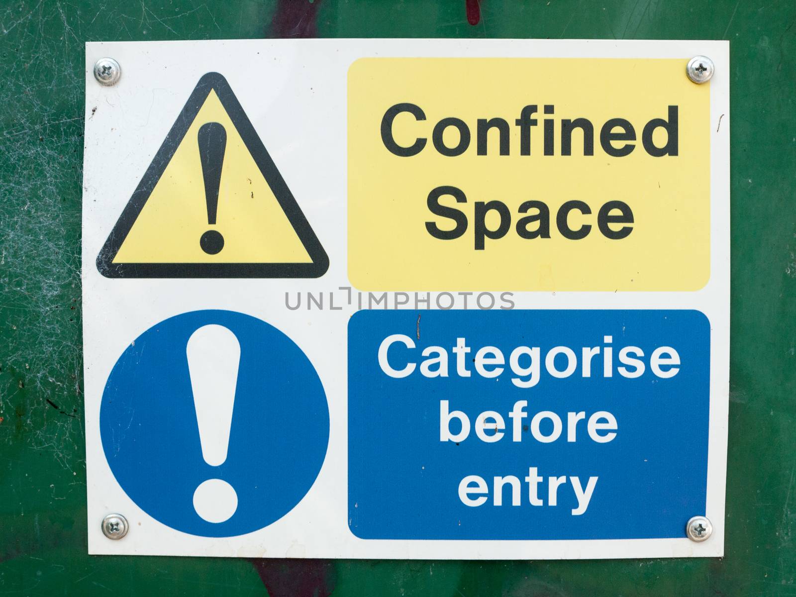 A photograph of typical signs warning of danger on a building site box