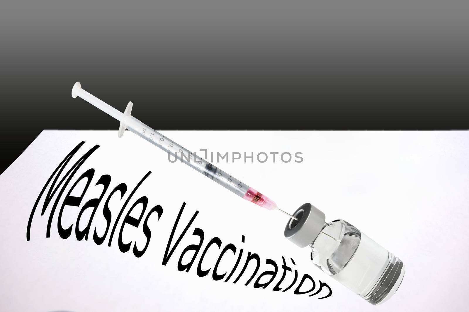 Syringe is filled with vaccine for measles vaccination.       by JFsPic