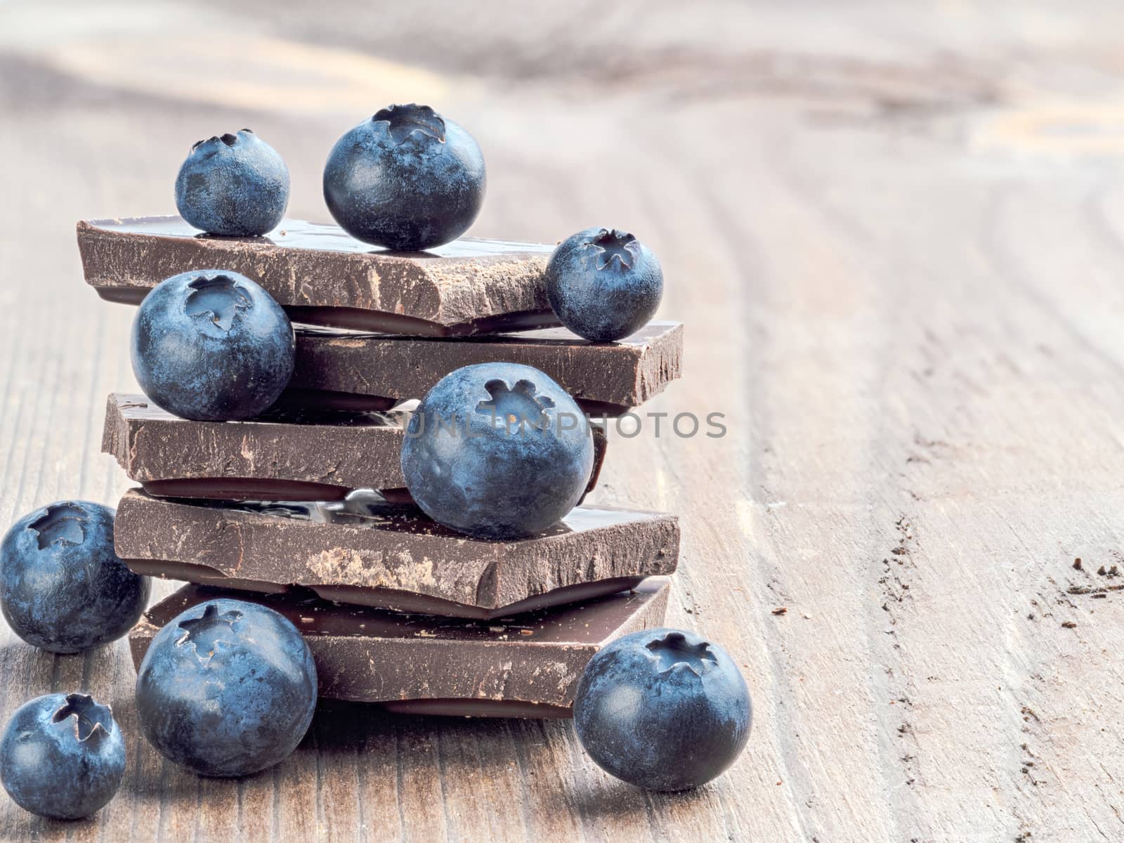 Stack of chocolate and blueberries with copy space by fascinadora