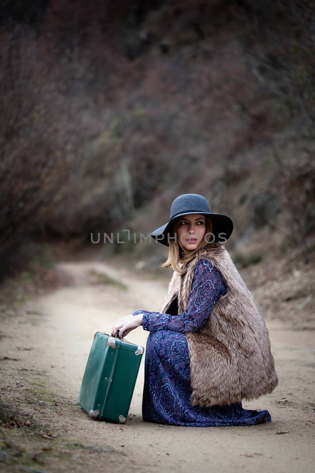 pretty girl with vintage case on a dirtroad by kokimk