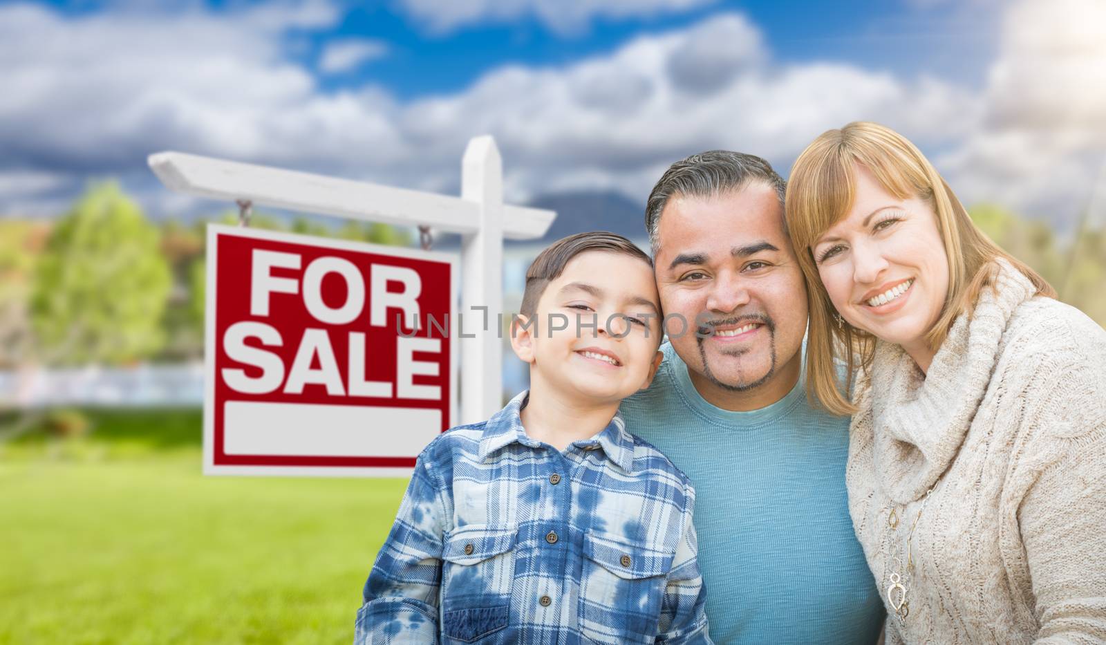 Mixed Race Family Portrait In Front of House and For Sale Real Estate Sign by Feverpitched