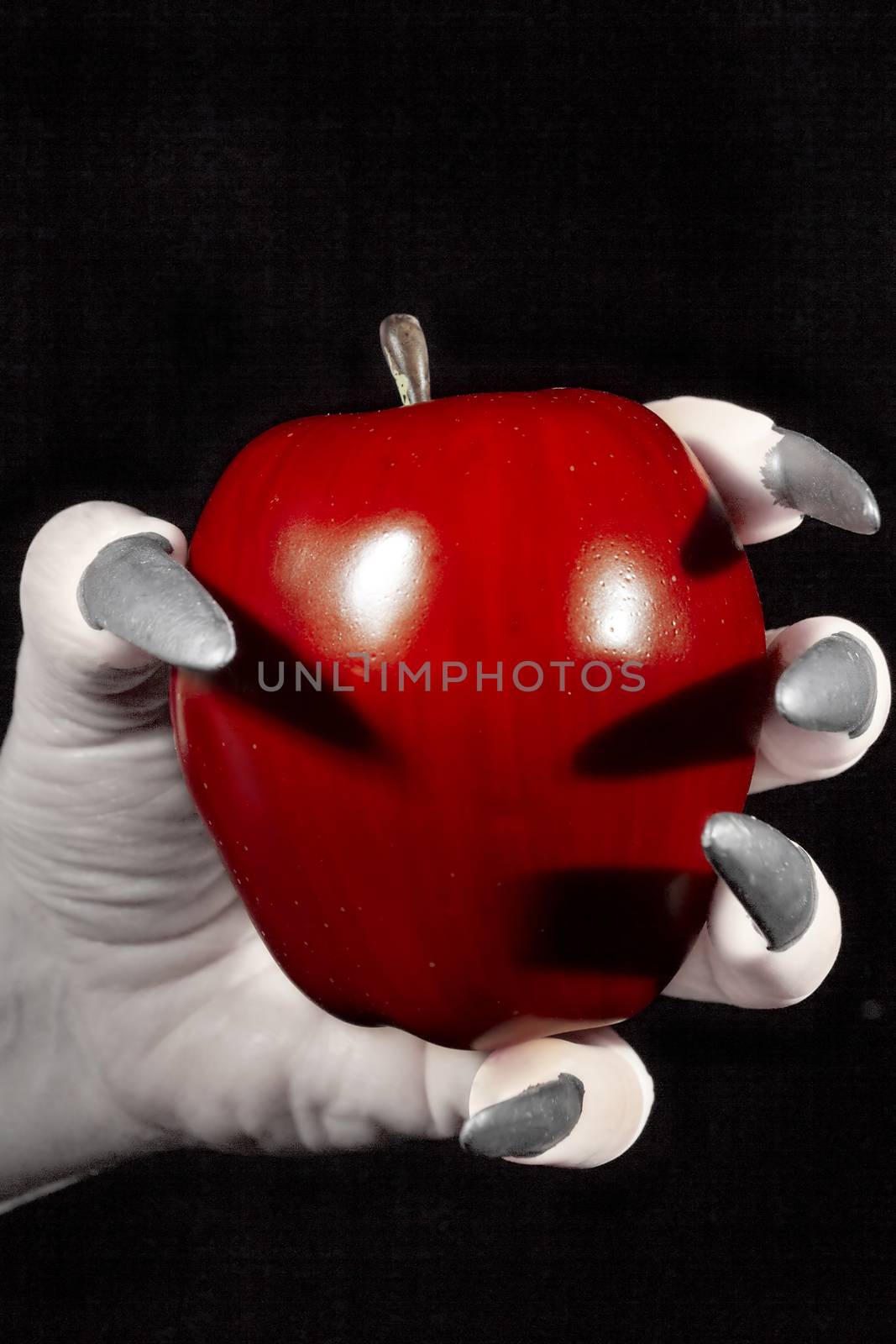 Apple in the hands with claws by VIPDesignUSA