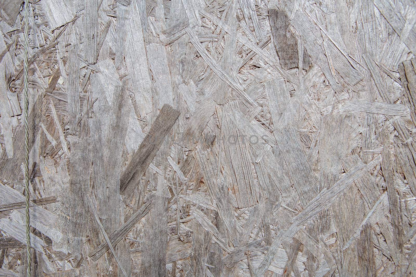Pressed wooden panel background, seamless texture of oriented strand board - OSB
