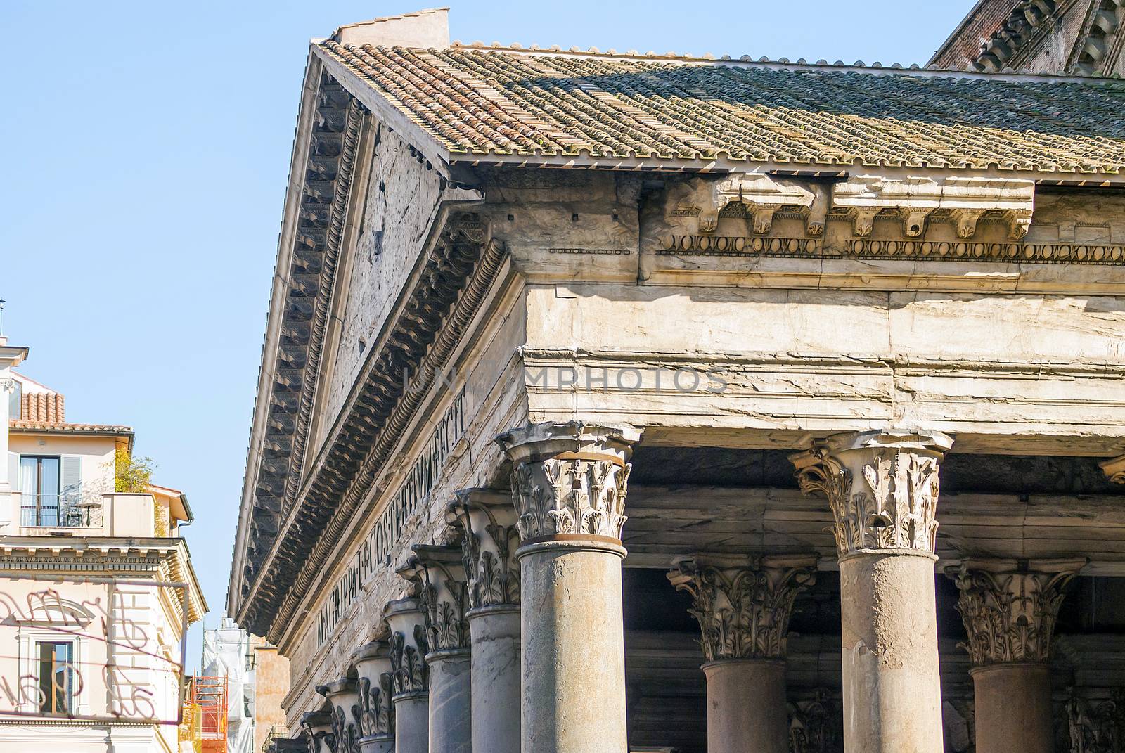 close up of the Pantheon pediment with latin inscription, corinthian capital columns, Rome, Italy