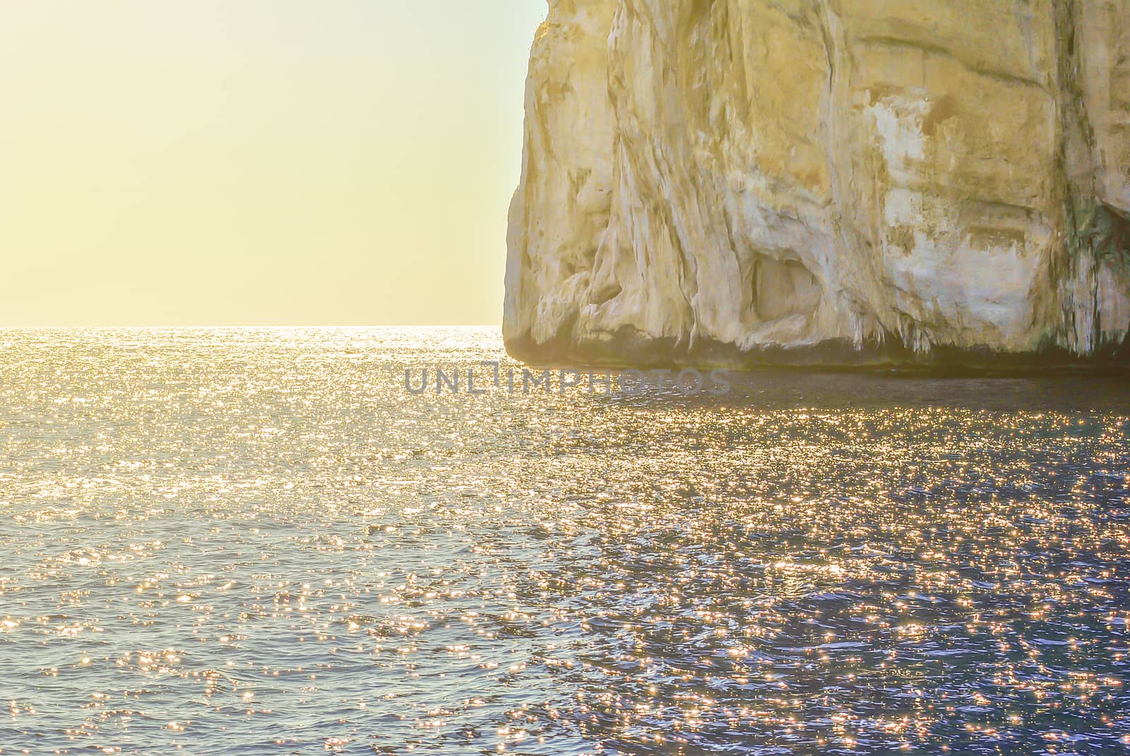 clear water sea with rocky coastline in Italy