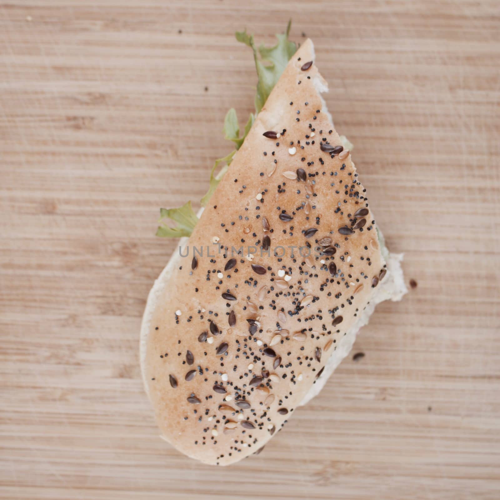 Tasty sandwich white bread on the wooden board in the kitchen.