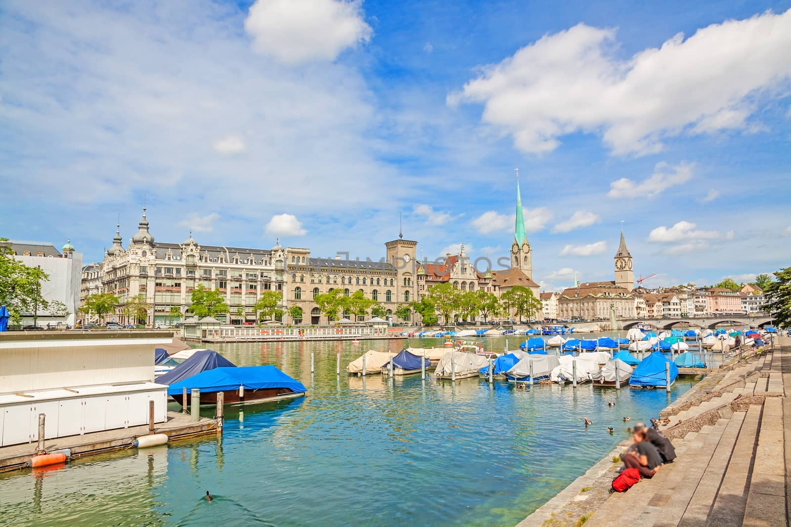 Panorama of historical part of Zurich with famous Fraumunster and St. Peter church on a beautiful summer day, Switzerland