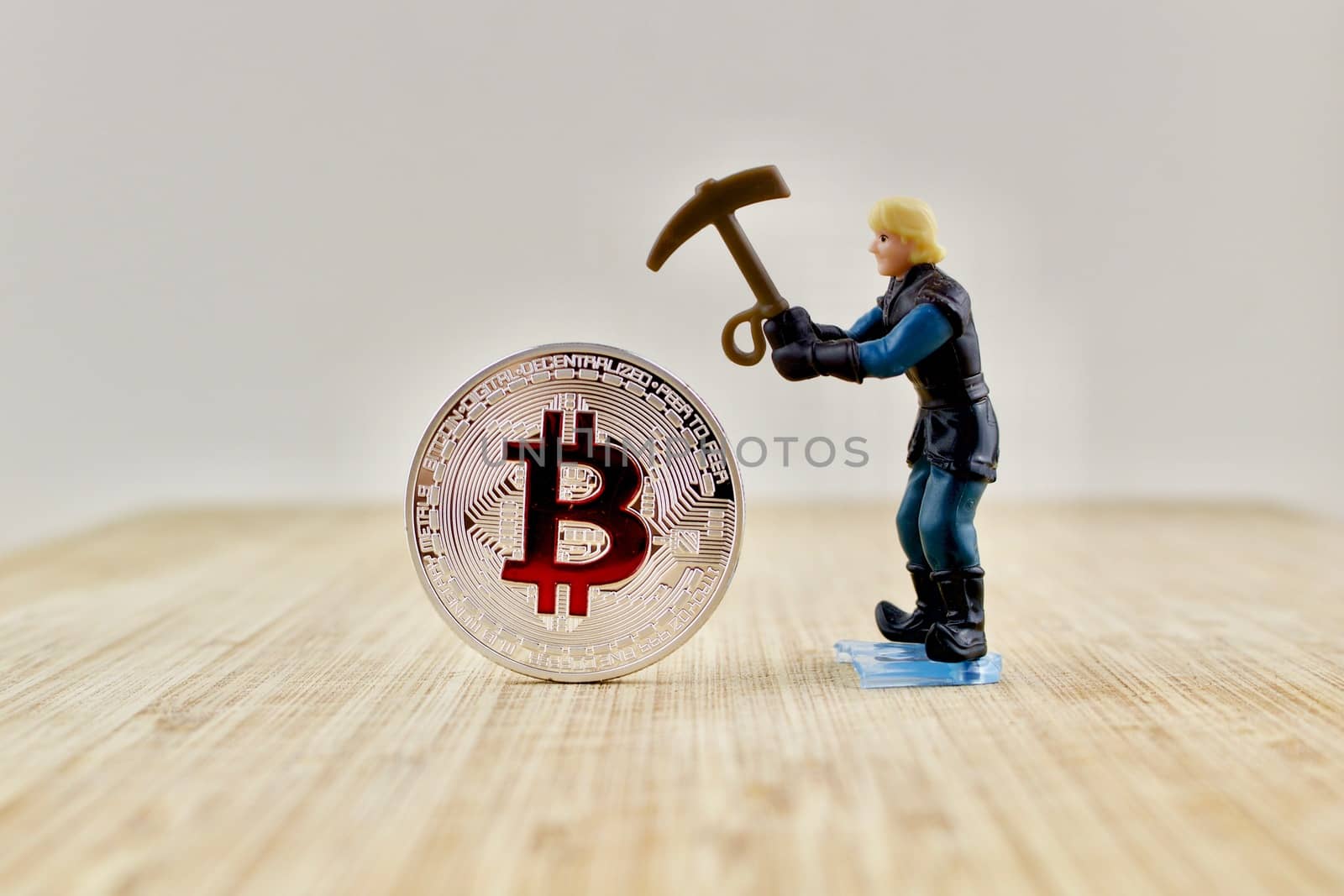 Digital currency physical silver bitcoin coin near miner.
