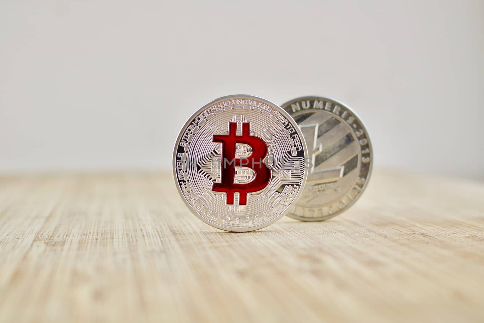 Digital currency physical silver bitcoin coin and Litecoin. Business concept.