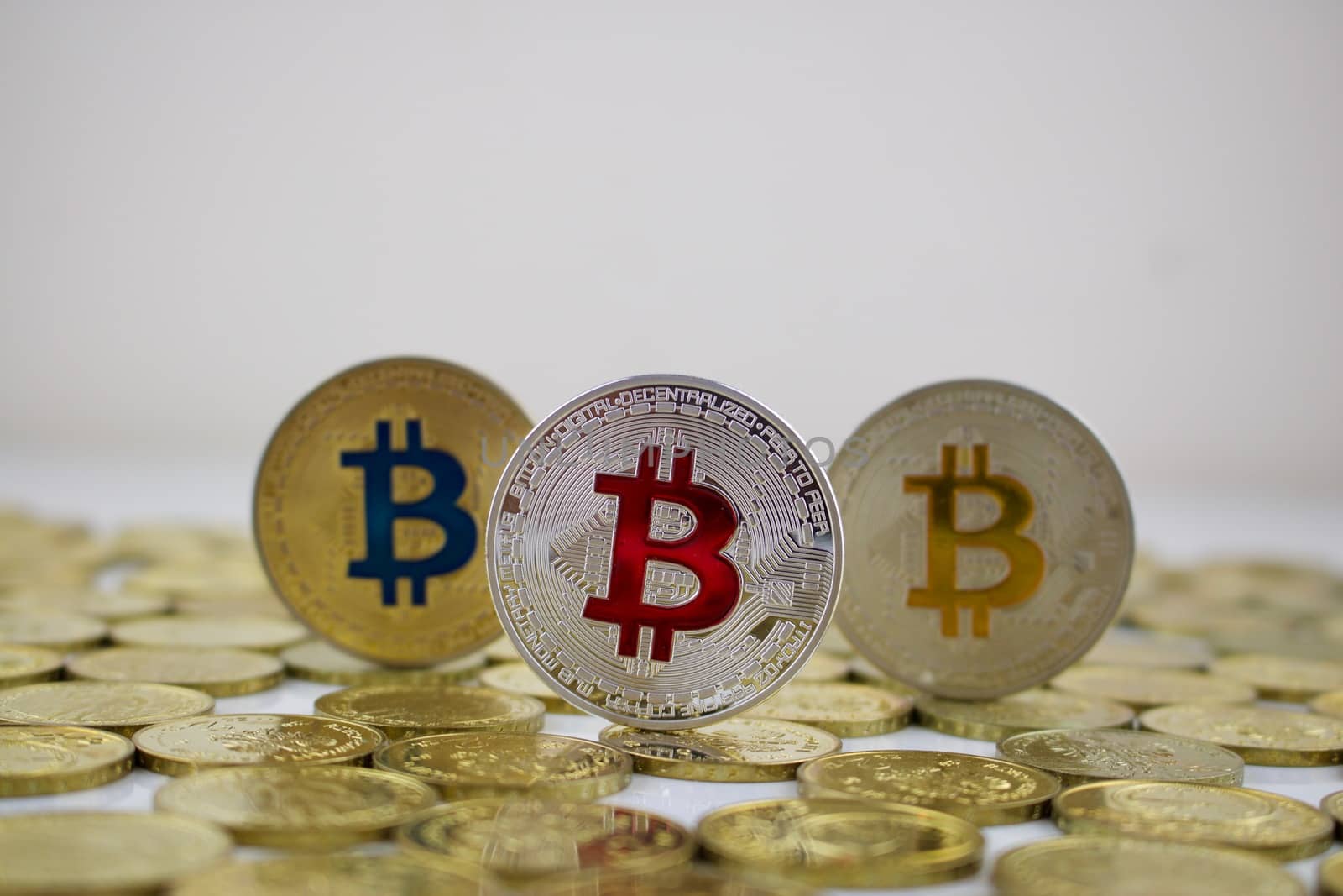 Digital currency physical silver and gold bitcoins on the money.