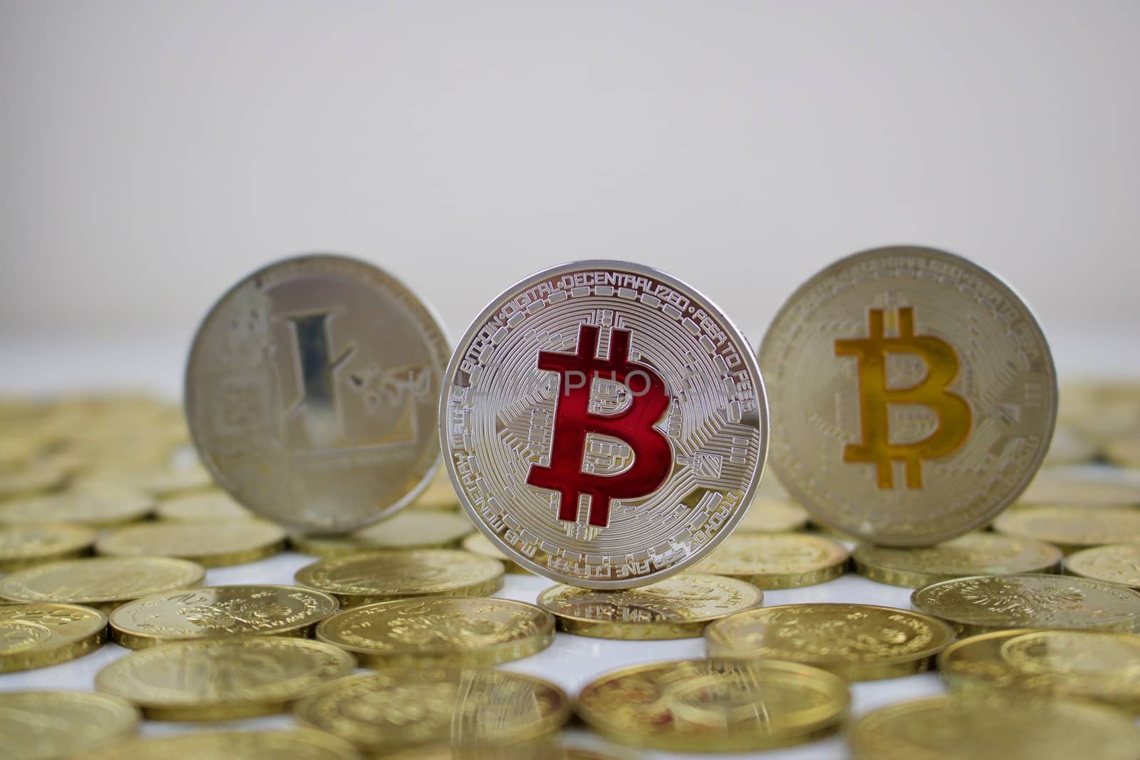 Digital currency physical silver bitcoin coin with red sign.