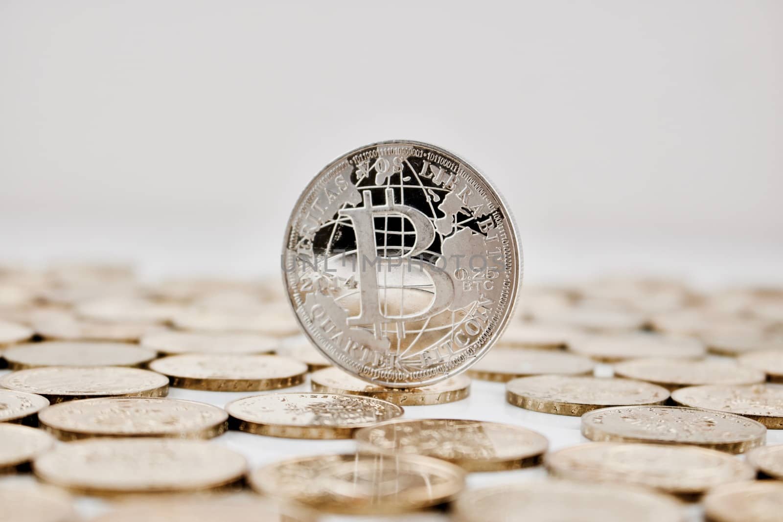 Digital currency physical silver bitcoin coin on the gold money.
