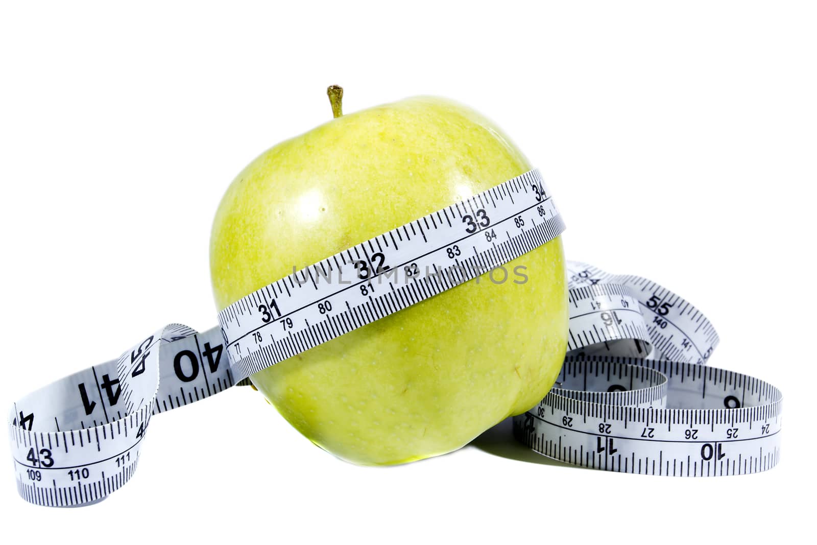 Green apple and measurement tape isolated on the white background