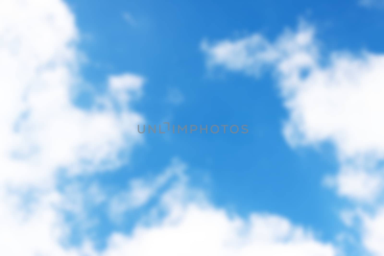 Blurred blue sky with clouds. Nature wallpaper background