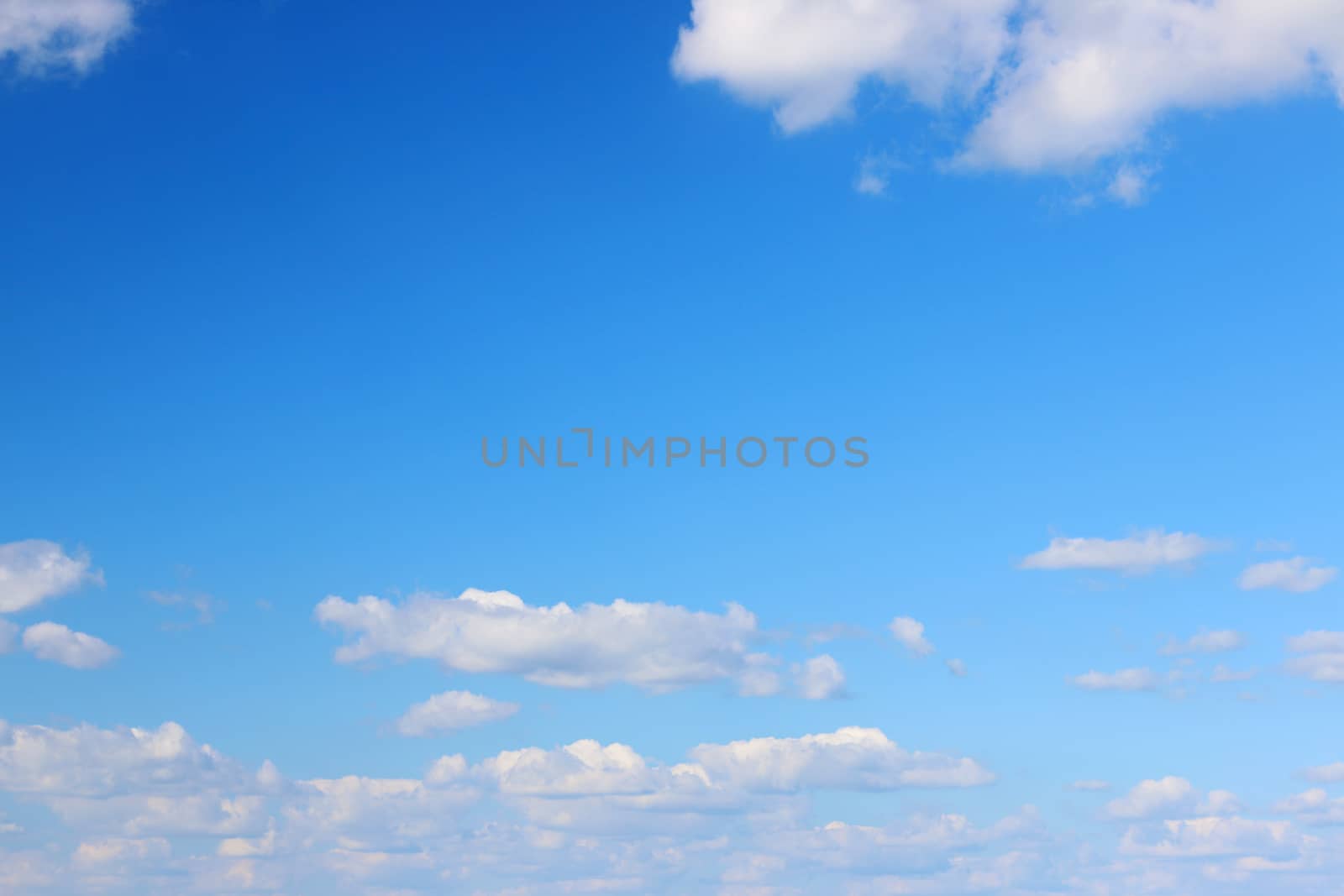 Blue gradient sky with clouds. Nature wallpaper background
