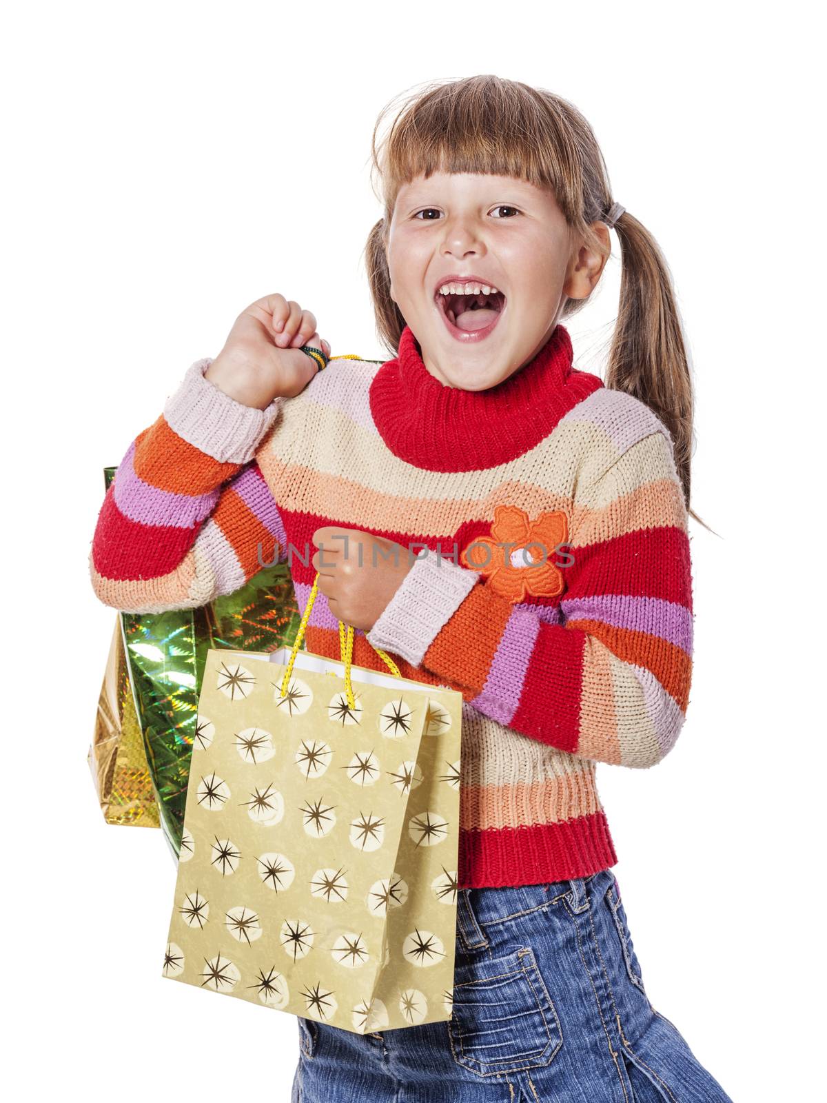 Smiling six years Girl holding presents bags isolated